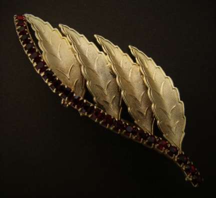 gold-tone leaves and faux ruby stones brooch