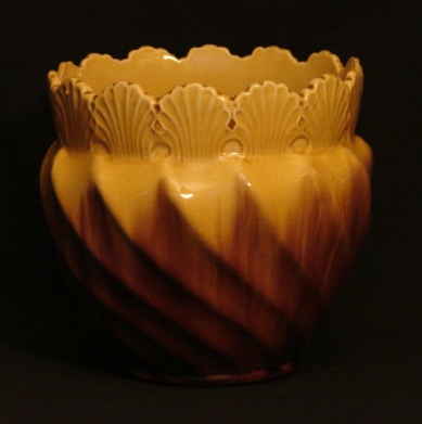 yellow majolica jardiniere with a shell pattern