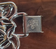 Coro Pegasus silver-tone openwork leaf wide bracelet signature