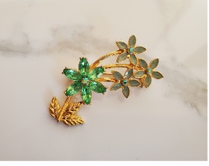 flowers with green enamel, green stones and aurora borealis rhinestones pin