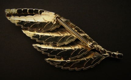 gold-tone leaves and faux ruby stones brooch back