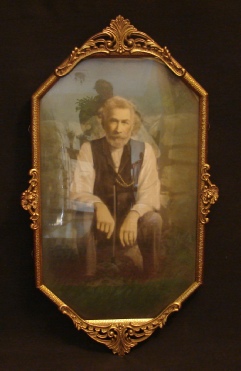 hand-colored portrait of a man sitting in the garden